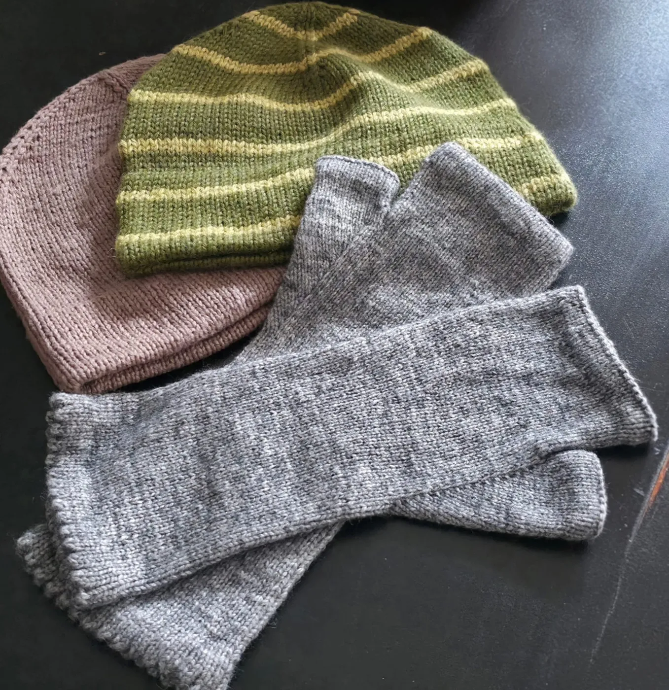 Handknitted hats and gloves in warm autumnal colours